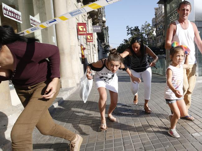 People leave a cordoned off area after a van ploughed into the crowd. Picture: AFP