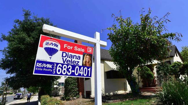 A house for sale sign in Alhambra, California. Sales of new homes were strong in January, but the virus outbrea is expected to hit sales in March and April. Picture: AFP