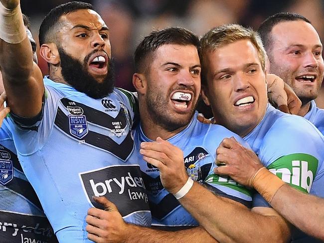 MELBOURNE, AUSTRALIA - JUNE 06:  Jake Trbojevic of the Blues is congratulated by team mates after scoring a try during game one of the State Of Origin series between the Queensland Maroons and the New South Wales Blues at the Melbourne Cricket Ground on June 6, 2018 in Melbourne, Australia.  (Photo by Quinn Rooney/Getty Images)