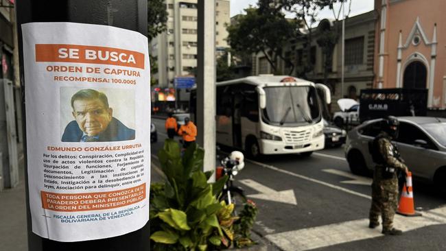 An arrest warrant poster for Venezuelan opposition leader Edmundo Gonzalez Urrutia in Caracas.