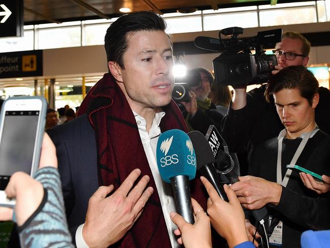 Former Melbourne footballer Andrew Leoncelli, a passenger on the flight, speaks to media at the international terminal. Picture: Jake Nowakowski