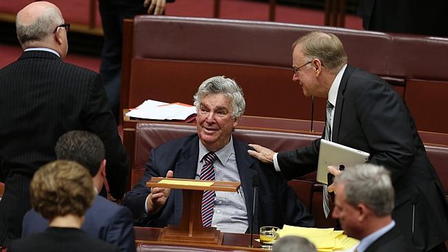 Senator Ron Boswell is congratulated by fellow senators after delivering his valedictory speech in the Senate chamber. Picture: Gary Ramage