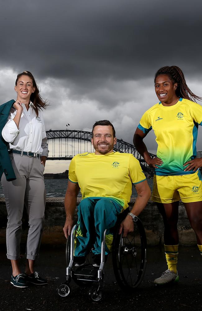 Australian athletes wear the official uniforms for the Gold Coast Commonwealth Games. Alicia Quirk (Opening Ceremony), Kurt Fearnley (Competition) and Ellis Green (Competition) pictured in Sydney. Picture: Toby Zerna