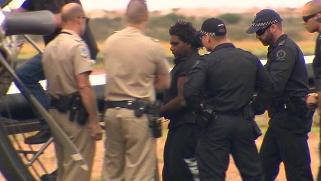 Murderer Dudley Davey being led away by police. Picture: Channel 7