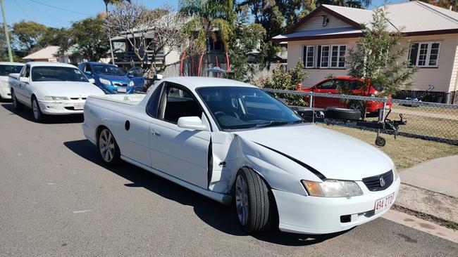 The white Holden ute involved in a crash which cracked a power pole in half at Barney Point.