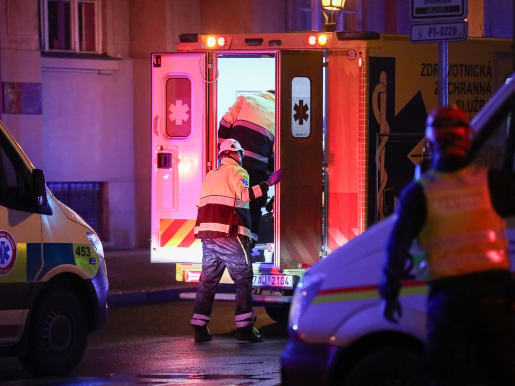 Paramedics load a stretcher into an ambulance after the shooting. Picture: Gabriel Kuchta/Getty Images