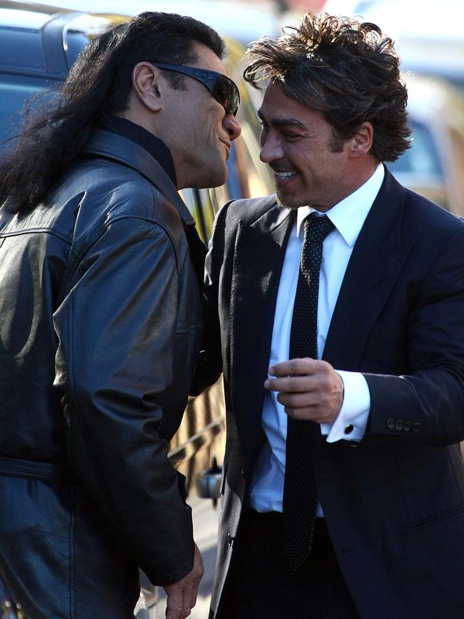 Tongan Sam greets John Ibrahim with a hug and kiss.