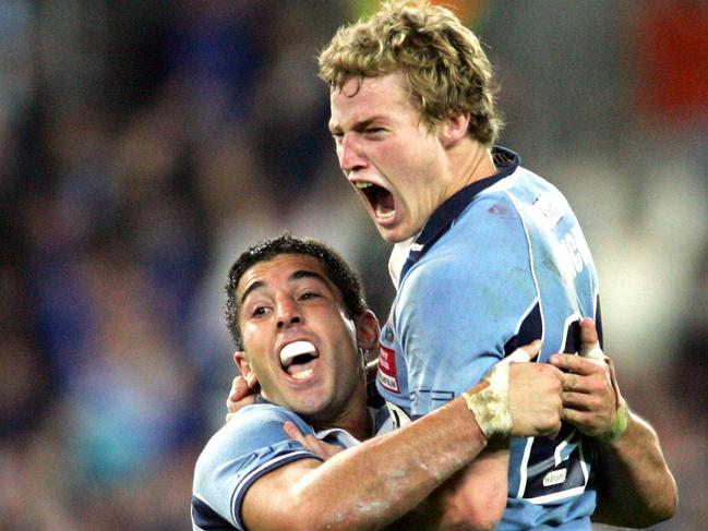 Finch (right) celebrates his matchwinning field goal in State of Origin I in 2006.