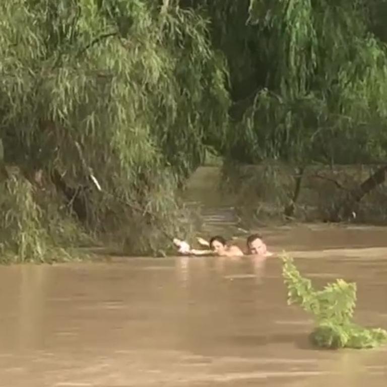 Three people, including a teenage girl and a hero cop have been rescued from floodwaters in Dalby. Picture: Anthony Gerard