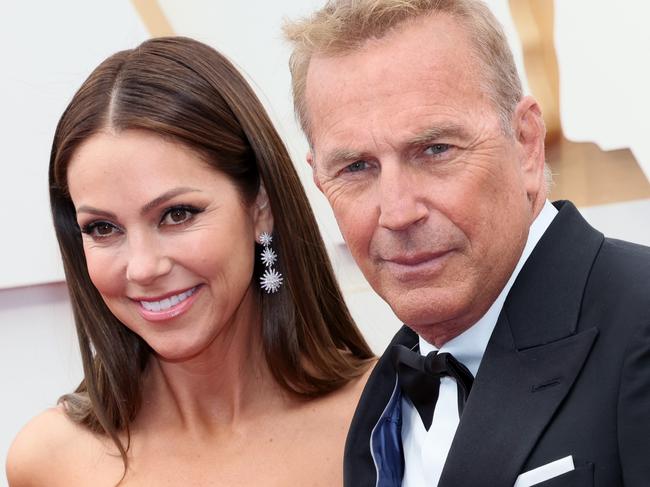 HOLLYWOOD, CALIFORNIA - MARCH 27: Christine Baumgartner and Kevin Costner attend the 94th Annual Academy Awards at Hollywood and Highland on March 27, 2022 in Hollywood, California. (Photo by David Livingston/Getty Images)