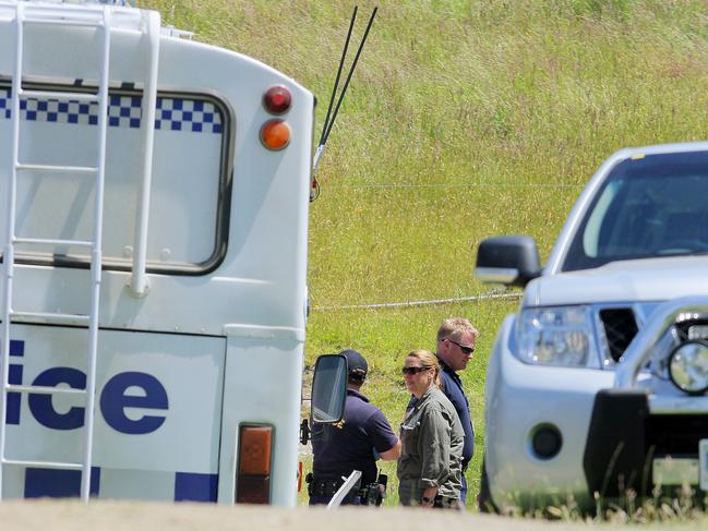 Police at the murder scene in 2011.