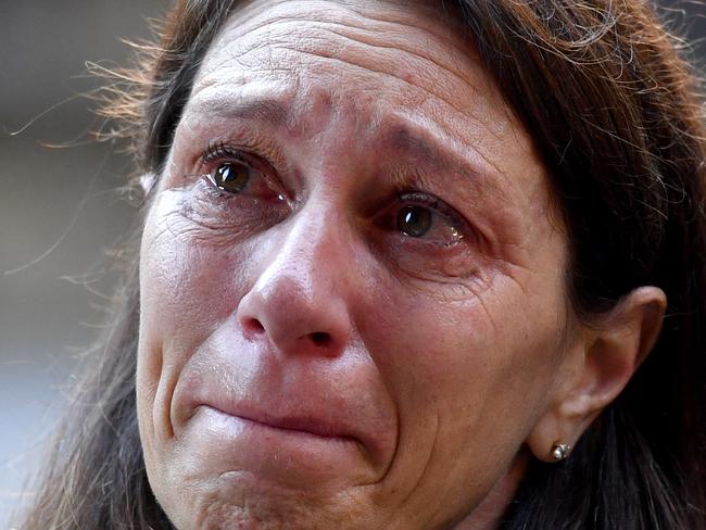 Carina Anderson, who is a member of the class action against Johnson & Johnson, outside the Federal Court in Sydney, Tuesday, July 4, 2017. More than 700 women suffering strong pain from vaginal mesh implants which were used to treat pelvic floor damage on about 8000 Australian women who have suffered life-altering complications after surgery, have launched a class action against global healthcare giant Johnson & Johnson in the Federal Court. (AAP Image/Mick Tsikas) NO ARCHIVING