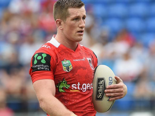 GOLD COAST, AUSTRALIA - APRIL 16: Josh McCrone of the Dragons waarms up on the field with team mates before the round seven NRL match between the Gold Coast Titans and the St George Illawarra Dragons at Cbus Super Stadium on April 16, 2016 in Gold Coast, Australia. (Photo by Matt Roberts/Getty Images)