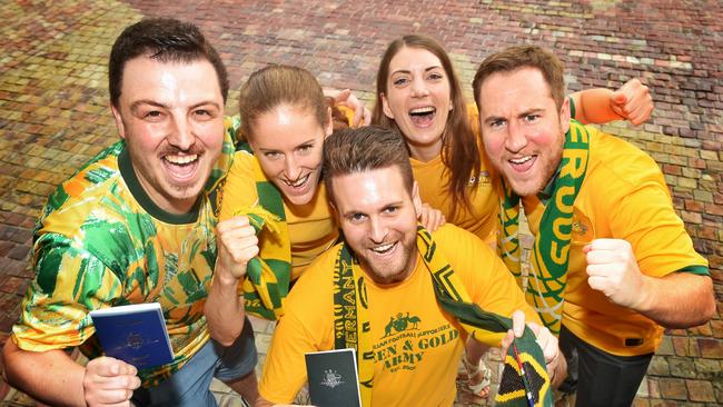 Socceroos fans in green and gold.