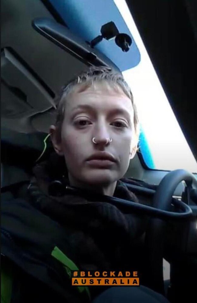 Mali Poppy Cooper, 22, pictured here locked to a car in the Harbour Tunnel on June 27. Picture: Facebook