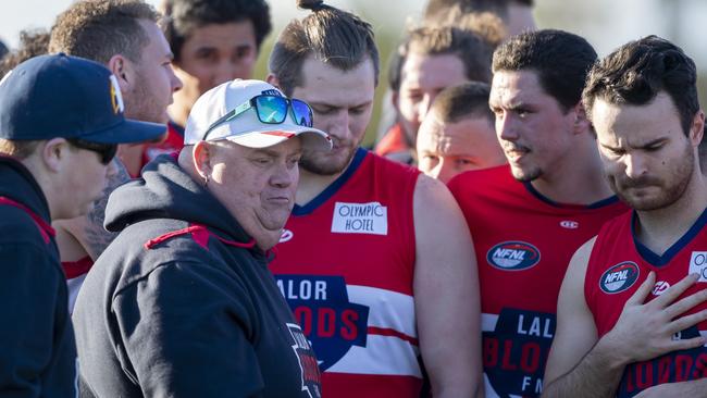 Lalor coach Gary Cutler speaks to his players during a break. Picture: Andy Brownbill