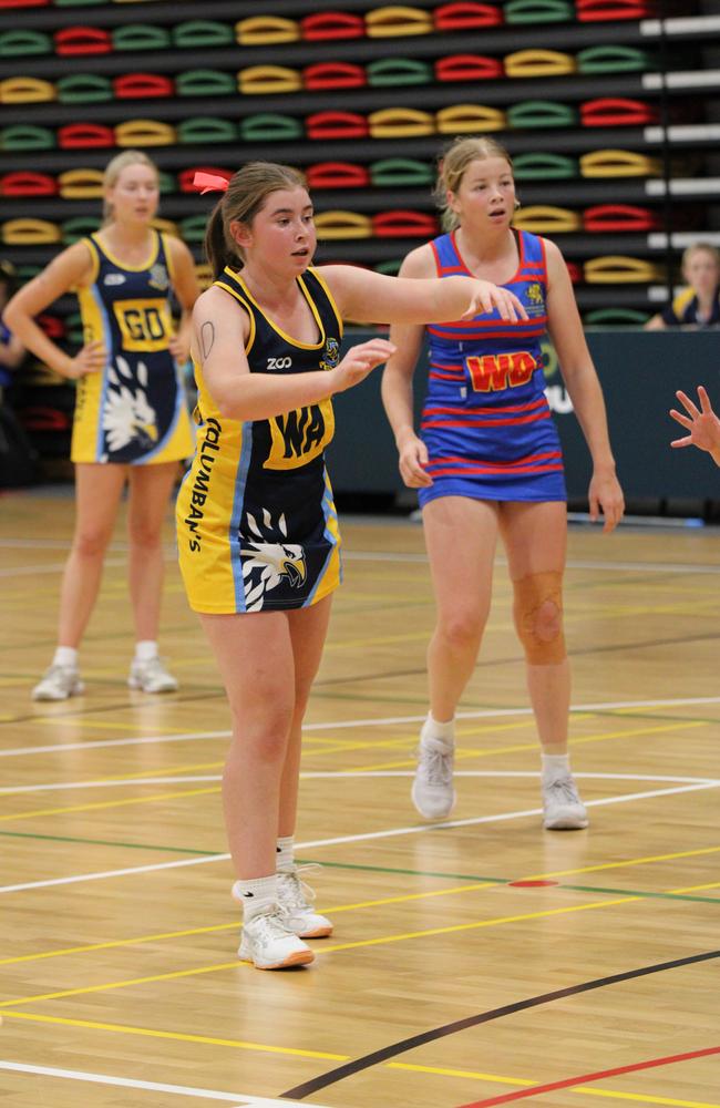 Netball action at QISSN 2024 held in Townsville. St Columbans College v Downlands College