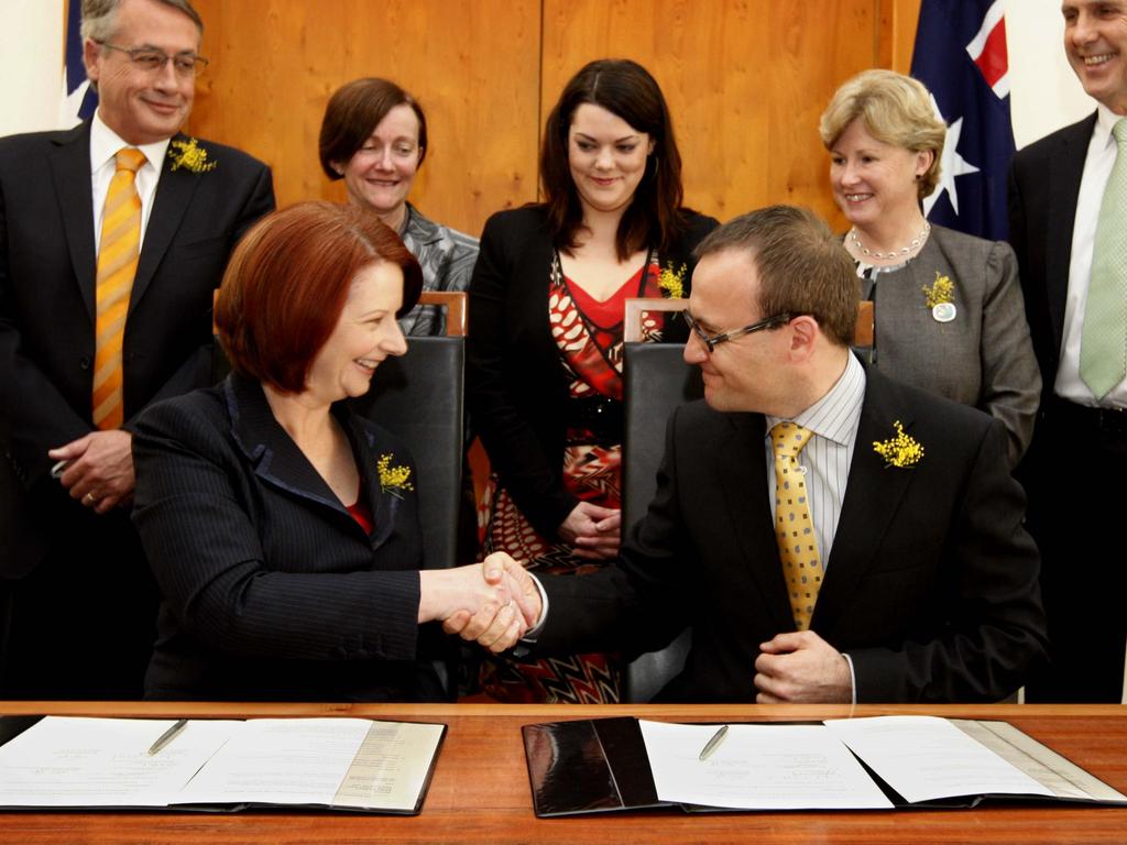 Then-Prime Minister Julia Gillard with Greens leader Adam Bandt.