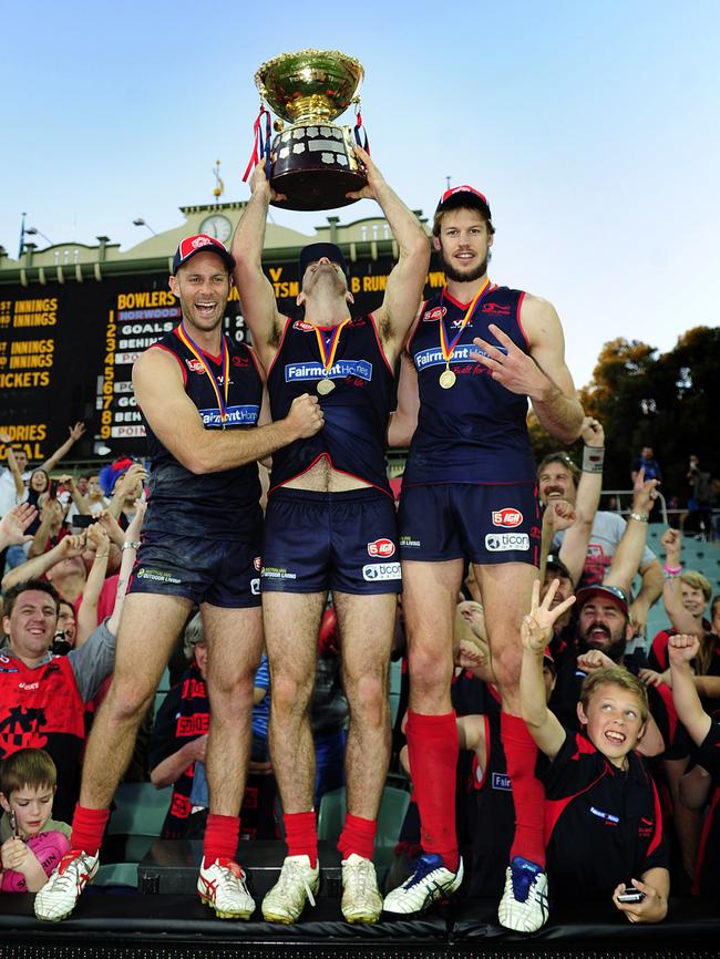 Jace Bode, Kieran McGuinness and Brady Dawe after Norwood’s 2014 grand final victory against Port Adelaide. Picture: Mark Brake