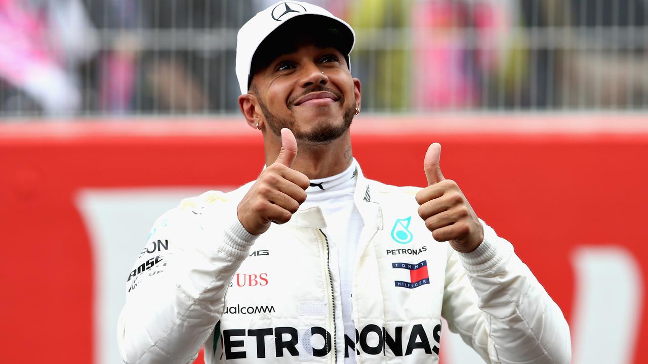 Pole position qualifier Lewis Hamilton gives it the thumbs up.