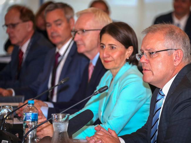 The Premier of New South Wales Gladys Berejiklian listens as Australian Prime Minister Scott Morrison speaks during the Meeting of the Council of Australian Governments. Picture: AFP