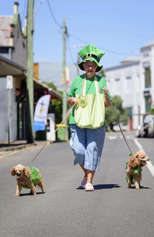 Noreen O'Reilly walked her dogs Honey (left) and Lucky in the Darling Downs Irish Club St Patrick's Day parade, Sunday, March 16, 2025. Picture: Kevin Farmer