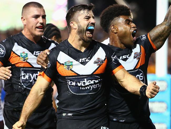 James Tedesco celebrates scoring his third try agains the Sea Eagles.