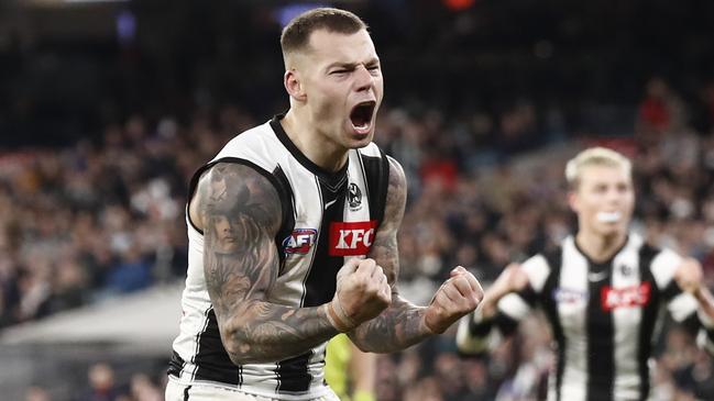 MELBOURNE, AUSTRALIA - AUGUST 05: Jamie Elliott of the Magpies celebrates a goal  during the round 21 AFL match between the Melbourne Demons and the Collingwood Magpies at Melbourne Cricket Ground on August 05, 2022 in Melbourne, Australia. (Photo by Darrian Traynor/Getty Images)