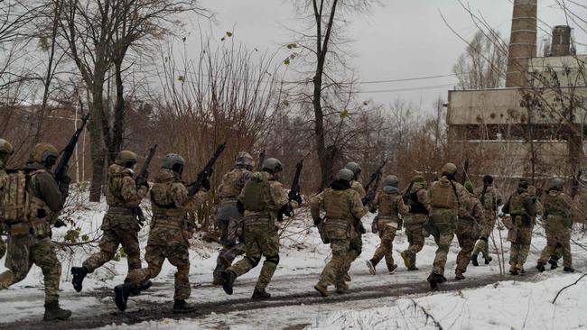 Civilians wearing military uniforms take part in a military training organised by Ukrainian soldiers of The Third Separate Assault Brigade in Kyiv. Picture: AFP