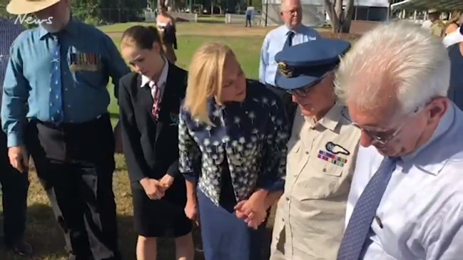 Darwin High School students and Lord Mayor Kon Vatskalis look at the new plaque at Bicentennial park