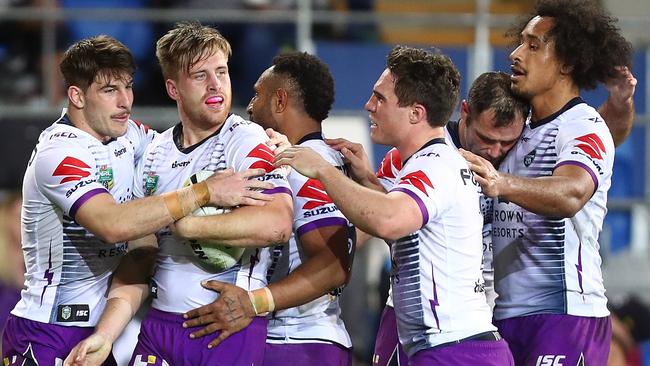 Cameron Munster celebrates a try with his Storm teammates. Picture: Getty Images