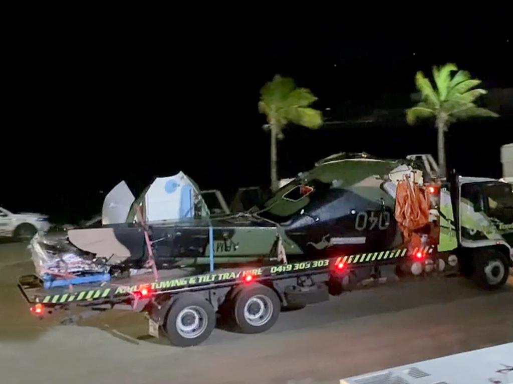 Debris from the crashed MRH-90 Taipan helicopter which killed all four on-board during Exercise Talisman Sabre being unloaded from a barge in Airlie Beach, Queensland. Picture 9News