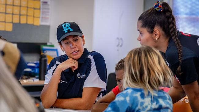 Indi Buckskin James (left) from Flinders University with students during a class at Mimili Anangu School. Credit: Michael Sullivan.