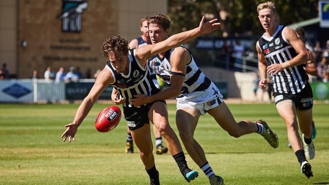 Port's Boyd Woodcock and South's Matthew Rose battle for the ball during the teams’ clash at Alberton Oval on Saturday. Picture: Matt Loxton