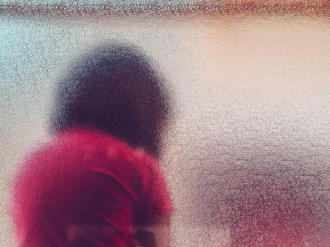 Silhouette of unrecognizable sad child. Generic iStock image.