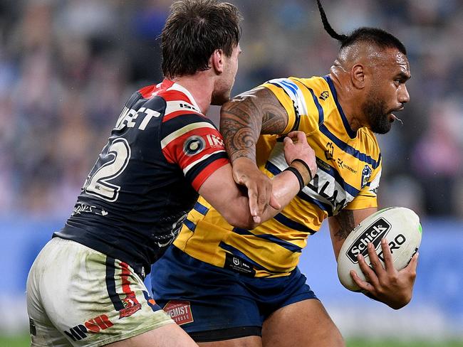 Junior Paulo of the Eels is tackled by Angus Crichton of the Roosters during the Round 6 NRL match between the Sydney Roosters and the Parramatta Eels at Bankwest Stadium in Sydney, Saturday, June 20, 2020. (AAP Image/Dan Himbrechts) NO ARCHIVING, EDITORIAL USE ONLY