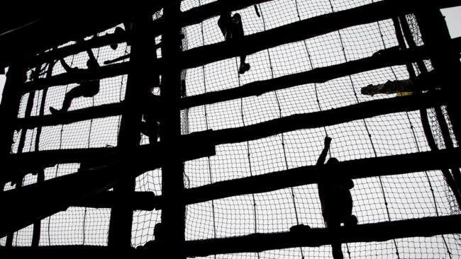 The obstacle course is also known as the 'killing fields'. This is a 14m high cargo net. 