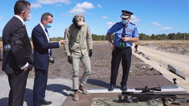 WA Premier Mark McGowan, Police Minister Paul Papalia and then police commissioner now WA Governor Chris Dawson at the event with the .50 calibre weapon. Picture: Twitter