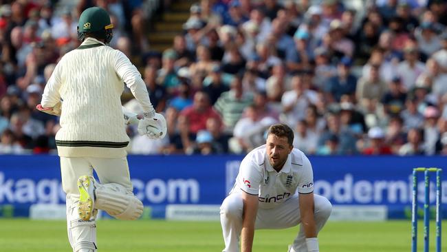 England's Ollie Robinson reacts as Australia's Nathan Lyon adds runs on day five. Picture: AFP