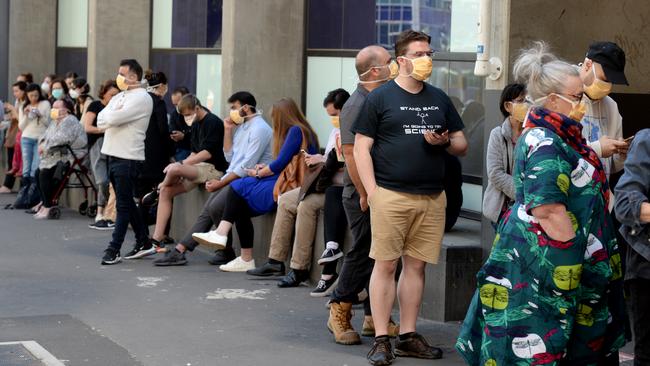 People queue outside the Royal Melbourne Hospital to be tested for the coronavirus. Picture: Andrew Henshaw