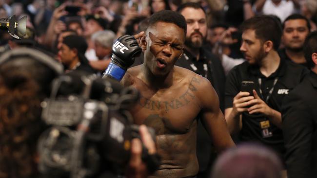 A man who danced alongside UFC middleweight Israel Adesanya (pictured) during his entrance at UFC 243 has been bashed at Southern Cross Railway Station. Picture: Darrian Traynor/Getty Images.