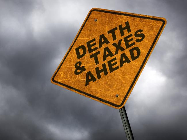 A road sign warning of the inevitability of death & taxes. inheritance tax generic