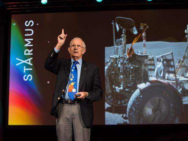 Charlie Duke, 88, at the Starmus science festival in Bratislava, with a photo of him on the moon in 1972. He is advising Nasa ahead of the Artemis II and Artemis III missions MAX ALEXANDER/STARMUS