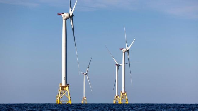 (FILES) Wind turbines generate electricity at the Block Island Wind Farm on July 7, 2022 near Block Island, Rhode Island. They're âuglyâ, âruin the landscapeâ and âkill whalesâ: Donald Trump accuses wind turbines of all sorts of evils and plunged their industry into turmoil as soon as he returned to the White House. âWe're not going to do the windmill thing,â the American president launched on January 20, the day of his inauguration, before digressing on the subject. âThey kill birds and ruin beautiful landscapesâ, âthey're all made in Chinaâ and âif you like whales, you don't want wind turbines eitherâ, said the Republican, before signing a series of executive orders at the end of the day to put a spanner in the industry's works. (Photo by JOHN MOORE / GETTY IMAGES NORTH AMERICA / AFP)