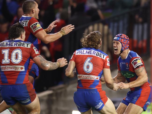 NEWCASTLE, AUSTRALIA - JUNE 05: Kalyn Ponga of the Knights celebrates a try with team mates during the round 14 NRL match between Newcastle Knights and Manly Sea Eagles at McDonald Jones Stadium, on June 05, 2025, in Newcastle, Australia. (Photo by Scott Gardiner/Getty Images)