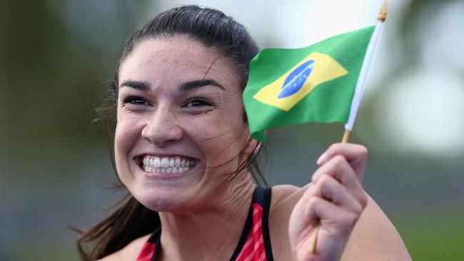 Michelle Jenneke celebrates winning the women's 100m hurdles final during the Australian Athletics Championships at Sydney Olympic Park.