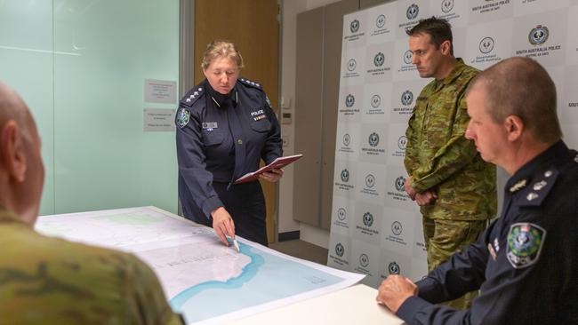 Inspector Wendy Mazik, Emergency and Major Events, Major Patrick Trainor, Plans Officer and Superintendent Scott Denny, COVID 19 Border Commander, conduct strategic planning during Operation COVID-19 Assist as SA Police Headquarters on Angus Street, Adelaide. Picture: ADF