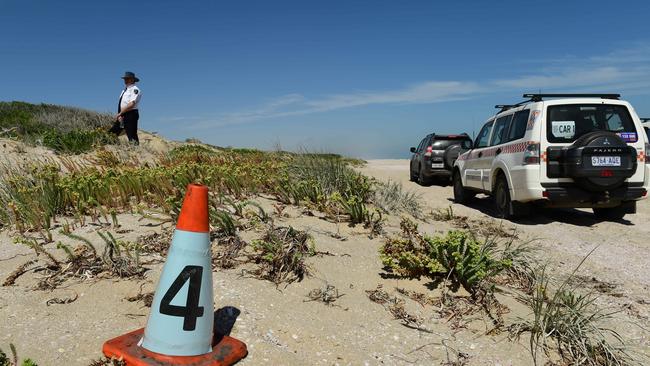 A court sheriff stands at the position where the vehicle of the accused was located. Picture: Mark Brake