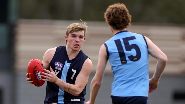 Vic Metro’s Tom Gross tries to evade an opponent during an under-17 trial match against NSW/ACT last Sunday. Picture: Getty Images