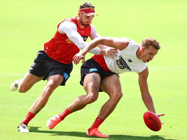 Caleb Graham and Jed Walter compete for the ball during a Gold Coast Suns AFL training session at People First Stadium on February 03, 2025 in Gold Coast, Australia. (Photo by Chris Hyde/Getty Images)